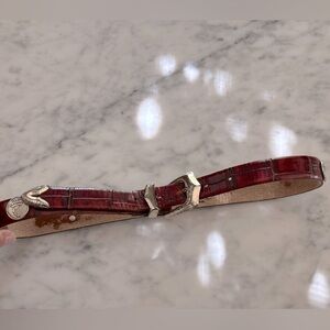 Leather embossed belt with silver buckle and silver etched golfers size 30”